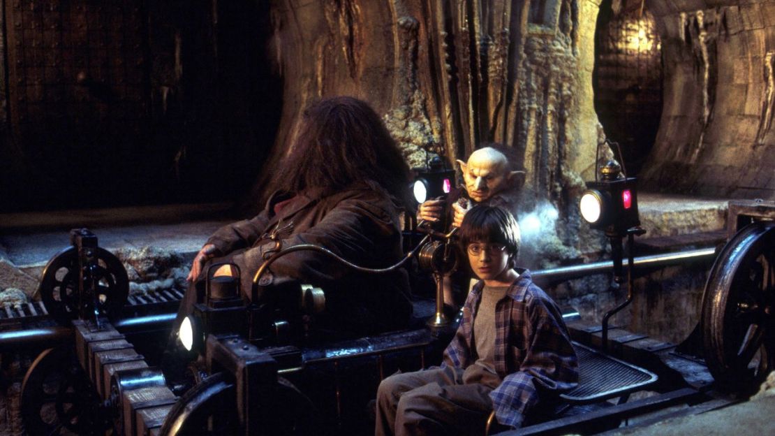 Robbie Coltrane, Verne Troyer and Daniel Radcliffe in 