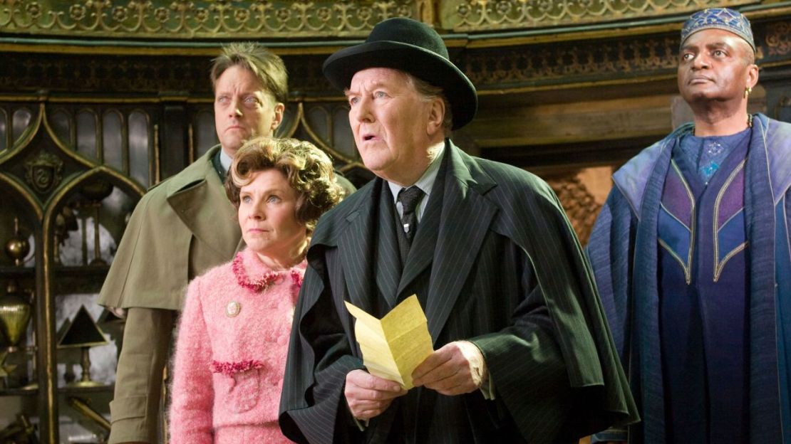 Imelda Staunton as Dolores Umbridge, Robert Hardy as Cornelius Fudge and George Harris as Kingsley Shacklebolt in 